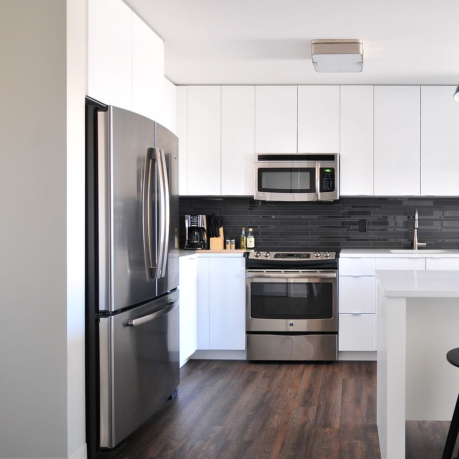 Spacious home gym setup with various weight lifting equipment