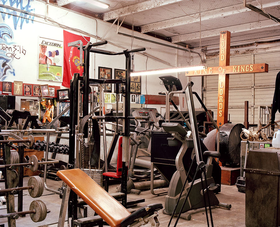 Interior view of Metroflex gym showcasing its weightlifting equipment and rugged atmosphere