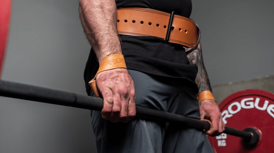 Athlete using weight lifting straps during workout