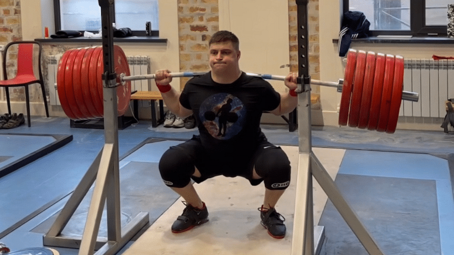 Weightlifter performing a squat with proper form